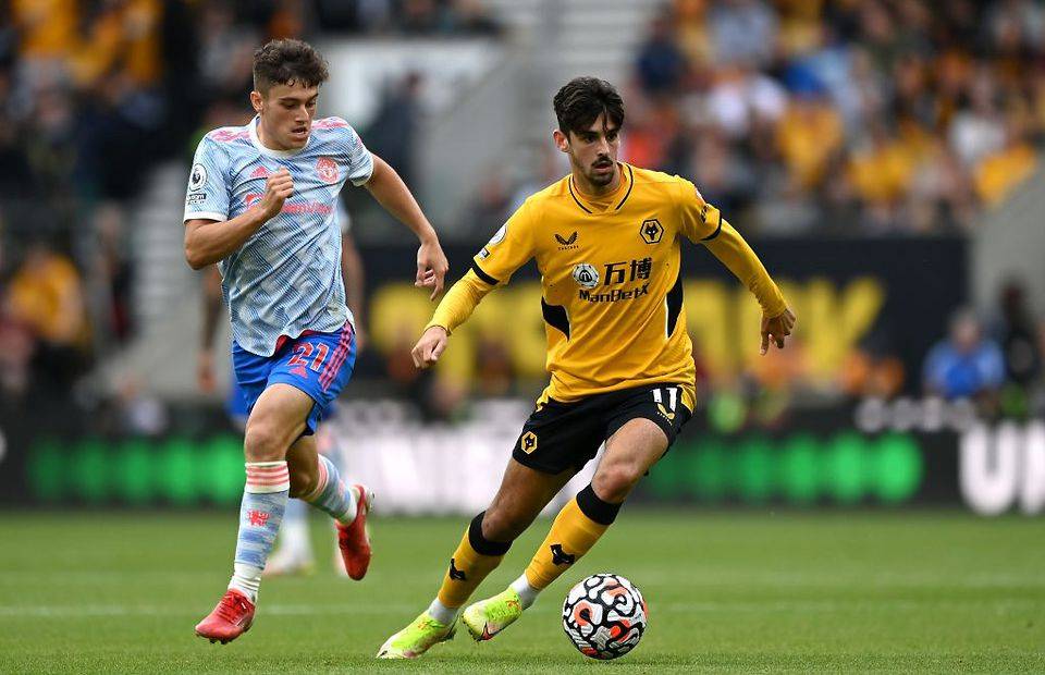 Francisco Trincao of Wolverhampton Wanderers battles for possession with Daniel James of Manchester United