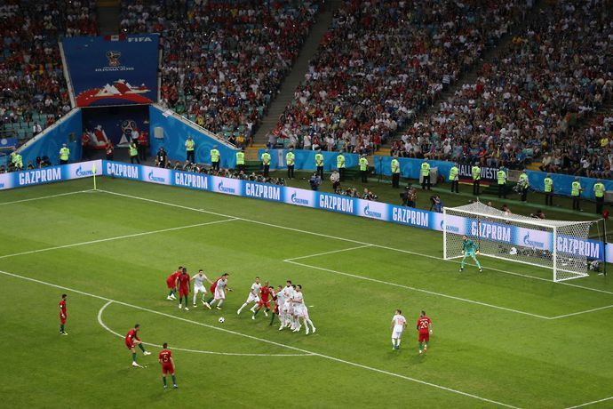 Cristiano Ronaldo scores a free-kick for Portugal against Spain at the 2018 World Cup in Russia