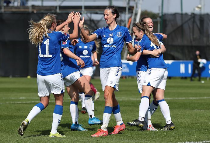 Claire Emslie and Jill Scott of Everton celebrate their side's third goal scored by team mate Simone Magill during the Barclays FA Women's Super League match between Everton and Aston Villa.
