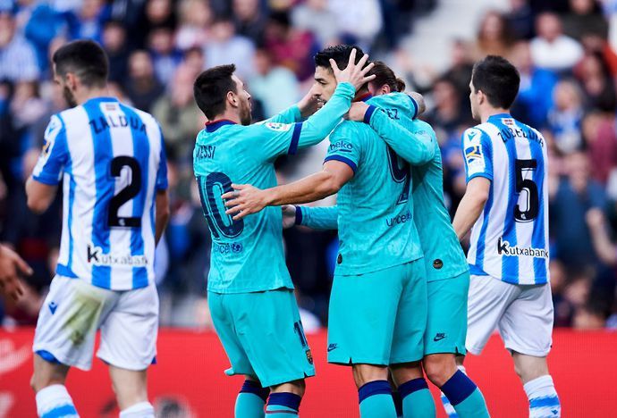 Lionel Messi, Luis Suarez and Antoine Griezmann celebrate a goal for Barcelona against Real Sociedad in La Liga
