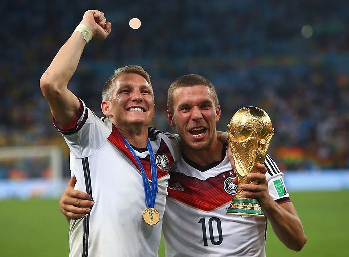 Lukasz Podolski celebrates winning the 2014 World Cup with Germany in Brazil