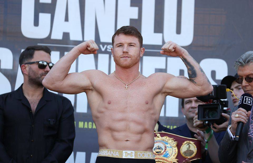 Canelo Alvarez weighs in against Billy Joe Saunders for Alvarez's WBC and WBA super middleweight titles and Saunders' WBO super middleweight title at AT&T Stadium on May 07, 2021 in Arlington, Texas.