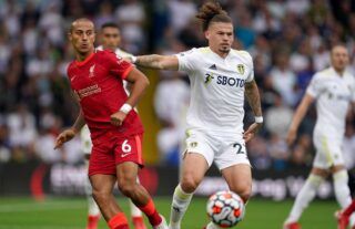 Liverpool star Thiago is tackled by Leeds United midfielder Kalvin Phillips at Elland Road