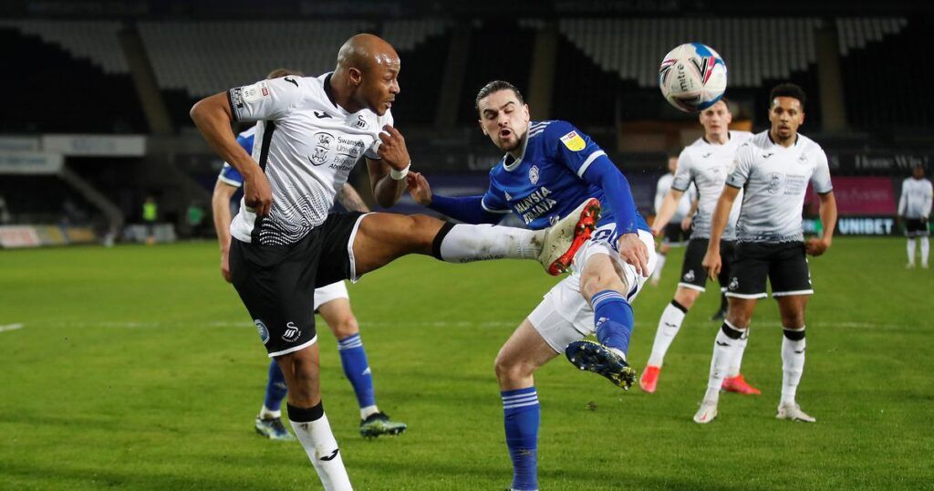 Cardiff City defender Ciaron Brown tackles Swansea striker Andre Ayew