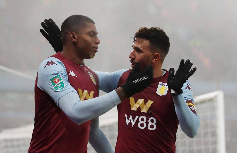 Wesley embraces his Aston Villa teammate during his time at the club