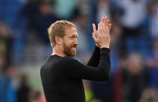 Brighton boss Graham Potter claps the club's supporters