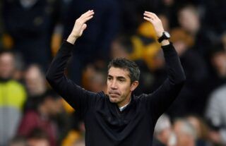 Wolves manager Bruno Lage raises his arms in celebration after recent win