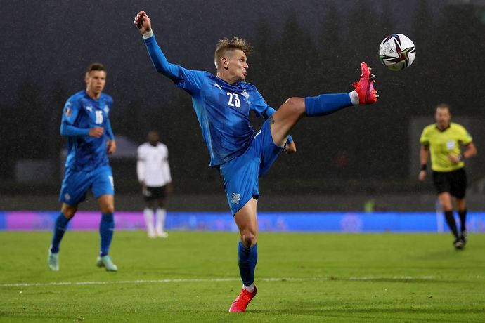 Ari Skulason of Iceland controls the ball during a 2022 FIFA World Cup Qualifier match.