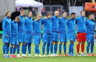 Players of Iceland stand for the national anthem prior to a 2022 FIFA World Cup Qualifier match.