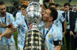 Lionel Messi with the Copa America trophy