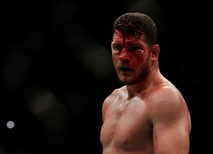 A bloodied Michael Bisping gazes into the distance