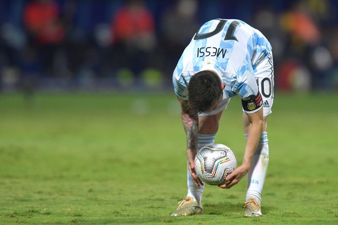 Lionel Messi of Argentina places the ball for a free-kick during a quarter-final match of Copa America Brazil 2021 between Argentina and Ecuador