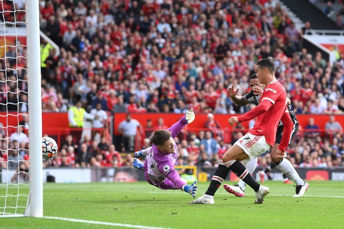 Cristiano Ronaldo of Manchester United scores their side's first goal during the Premier League match between Manchester United and Newcastle United