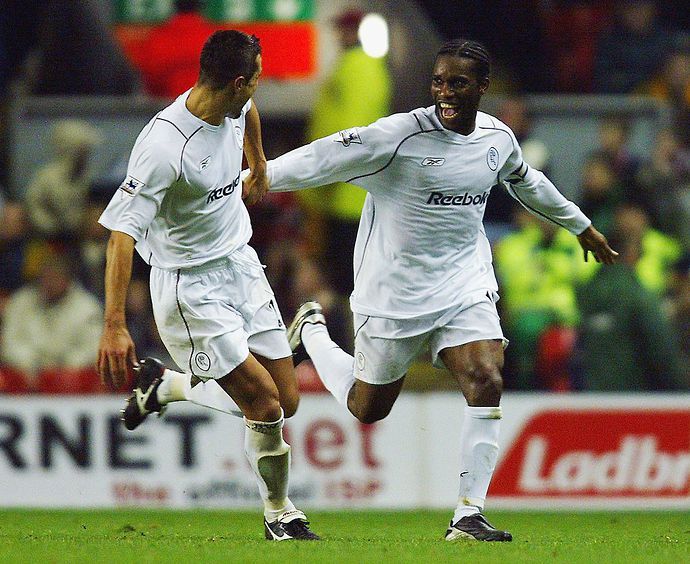 Jay-Jay Okocha (right) in action for Bolton