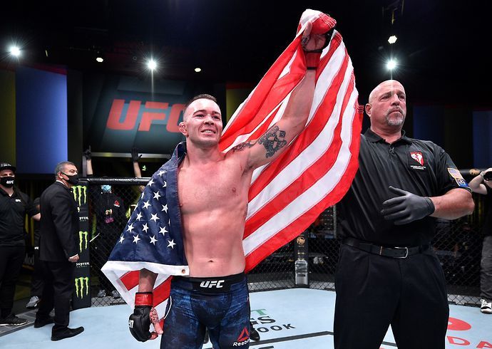 Colby Covington celebrates after beating Tyron Woodley