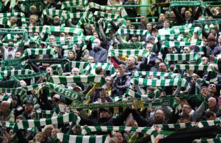 Celtic fans putting their scarves in the air