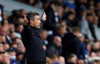 Wolves manager Bruno Lage with his arms outstretched on the touchline