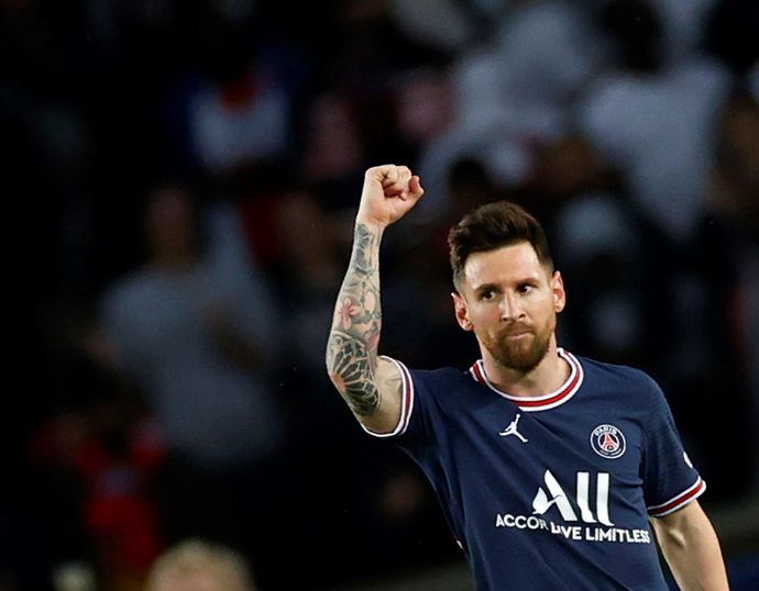 Lionel Messi celebrates scoring for PSG