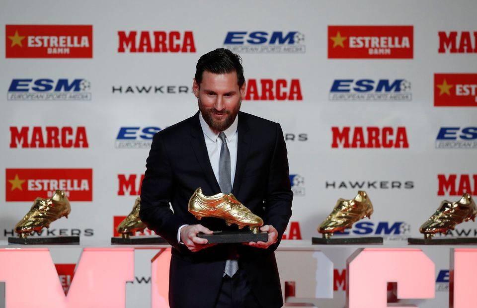 Lionel Messi with his European Golden Shoe award