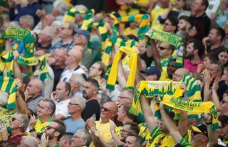 Norwich City fans cheer on their side at Carrow Road