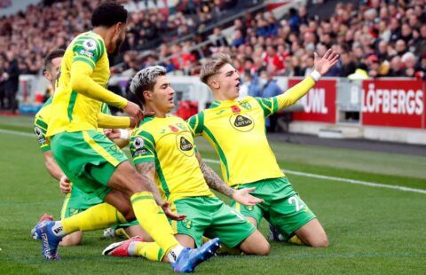 Norwich City players celebrate during their win at Brentford