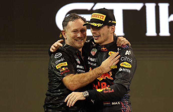 Christian Horner celebrates with Max Verstappen after beating Lewis Hamilton and Toto Wolff