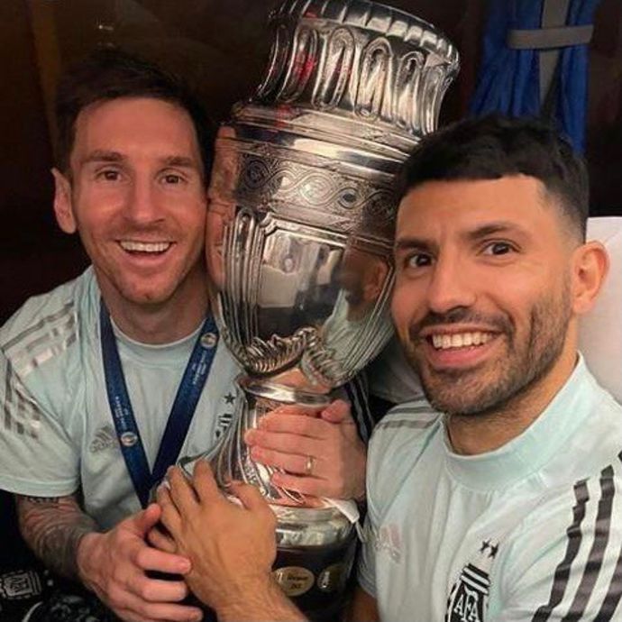 Lionel Messi and Sergio Aguero pictured with the Copa America trophy 