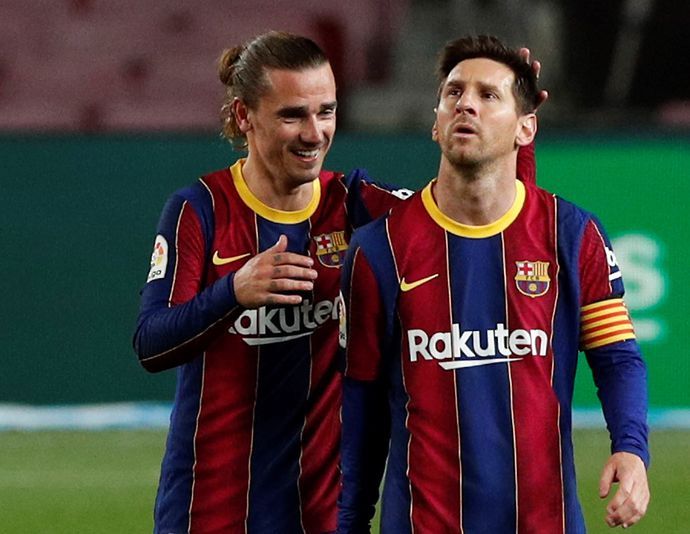 Lionel Messi pictured with Antoine Griezmann