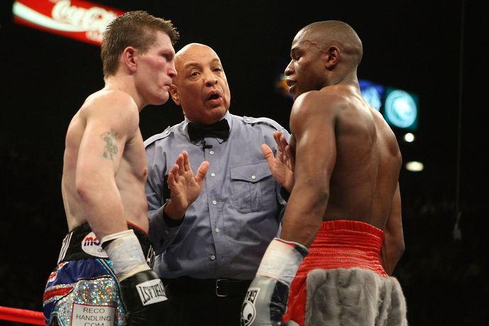 Ricky Hatton stares down Floyd Mayweather in the face-off before their fight