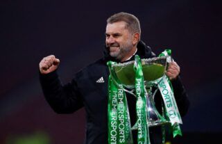 Celtic manager Ange Postecoglou celebrates with trophy