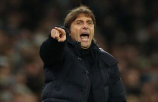 Tottenham Hotspur head coach Antonio Conte points the way