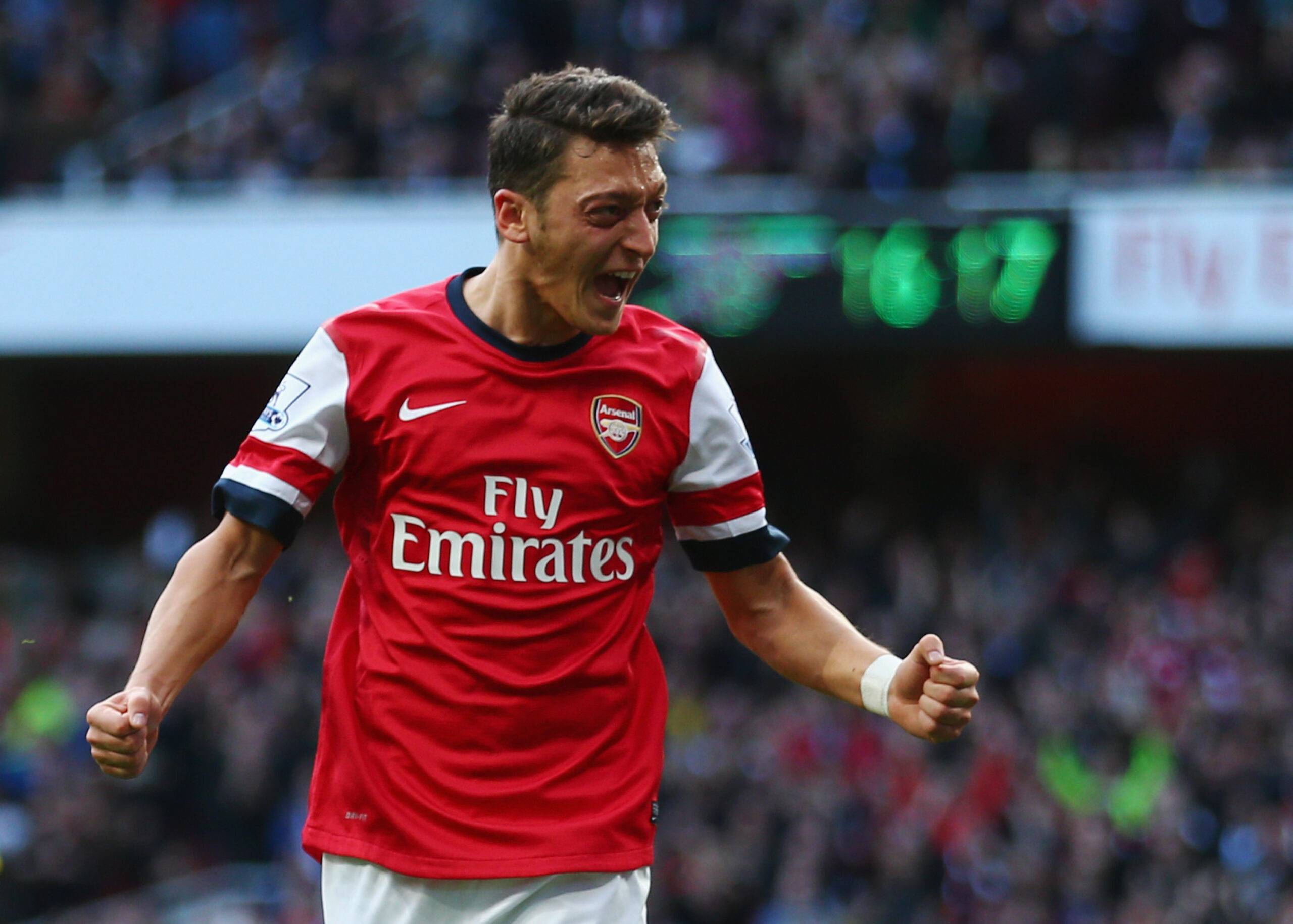 Mesut Ozil celebrates for Arsenal.