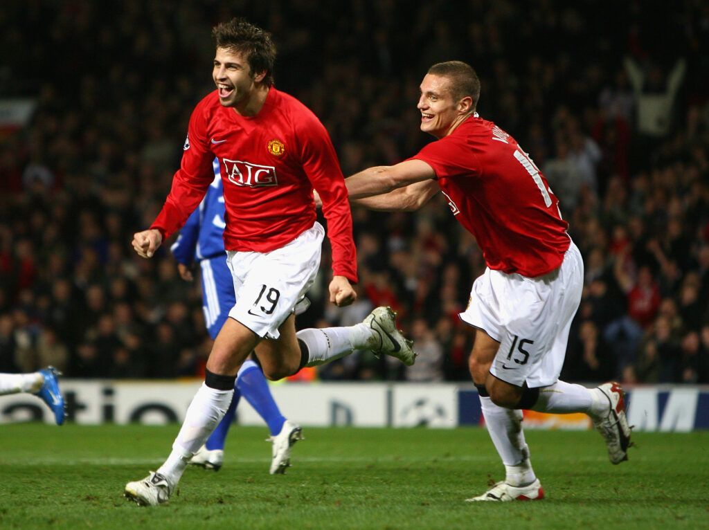 Pique and Vidic celebrate for Manchester United 