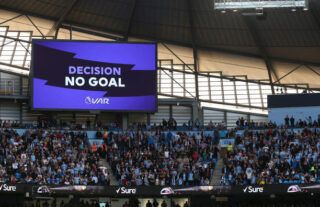 VAR ruling out a goal during a Premier League match between Manchester City and Tottenham Hotspur.