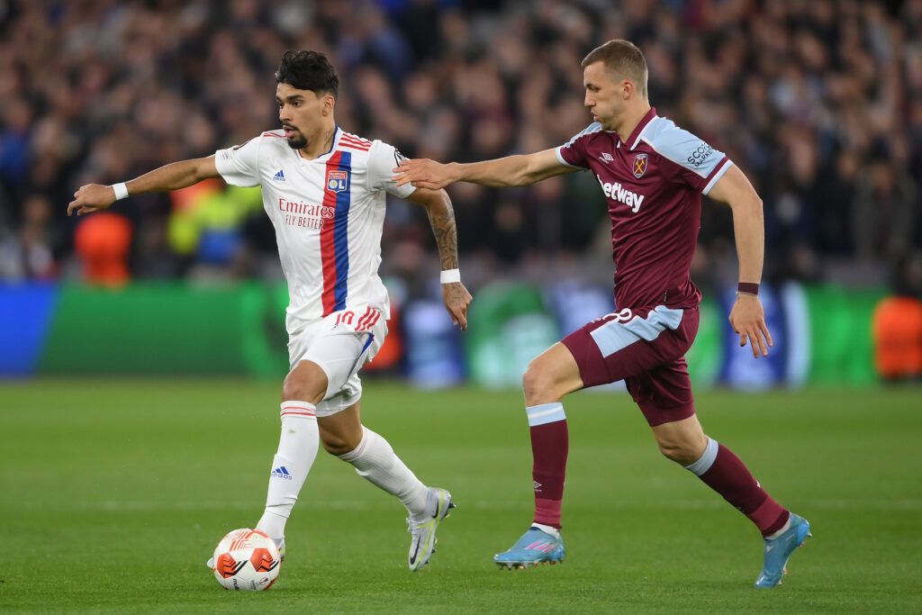 Lucas Paqueta of Lyon is challenged by Tomas Soucek of West Ham United during the UEFA Europa League Quarter Final Leg One match between West Ham United and Olympique Lyon at Olympic Stadium on April 07, 2022 in London