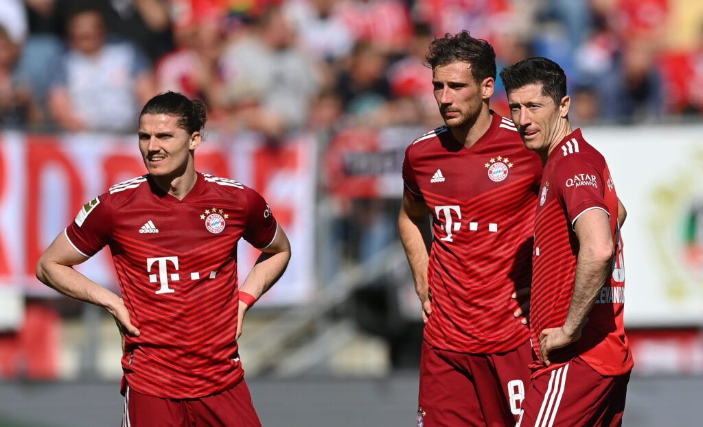 Marcel Sabitzer, Leon Goretzka and Robert Lewandowski of FC Bayern Muenchen look on