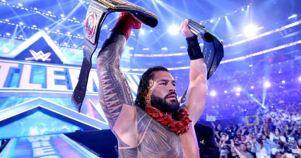 Roman Reigns holding two titles at WrestleMania 38