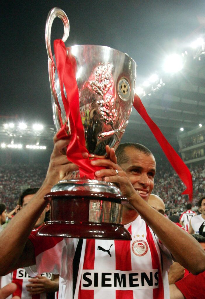 Rivaldo lifts a trophy with Olympiakos