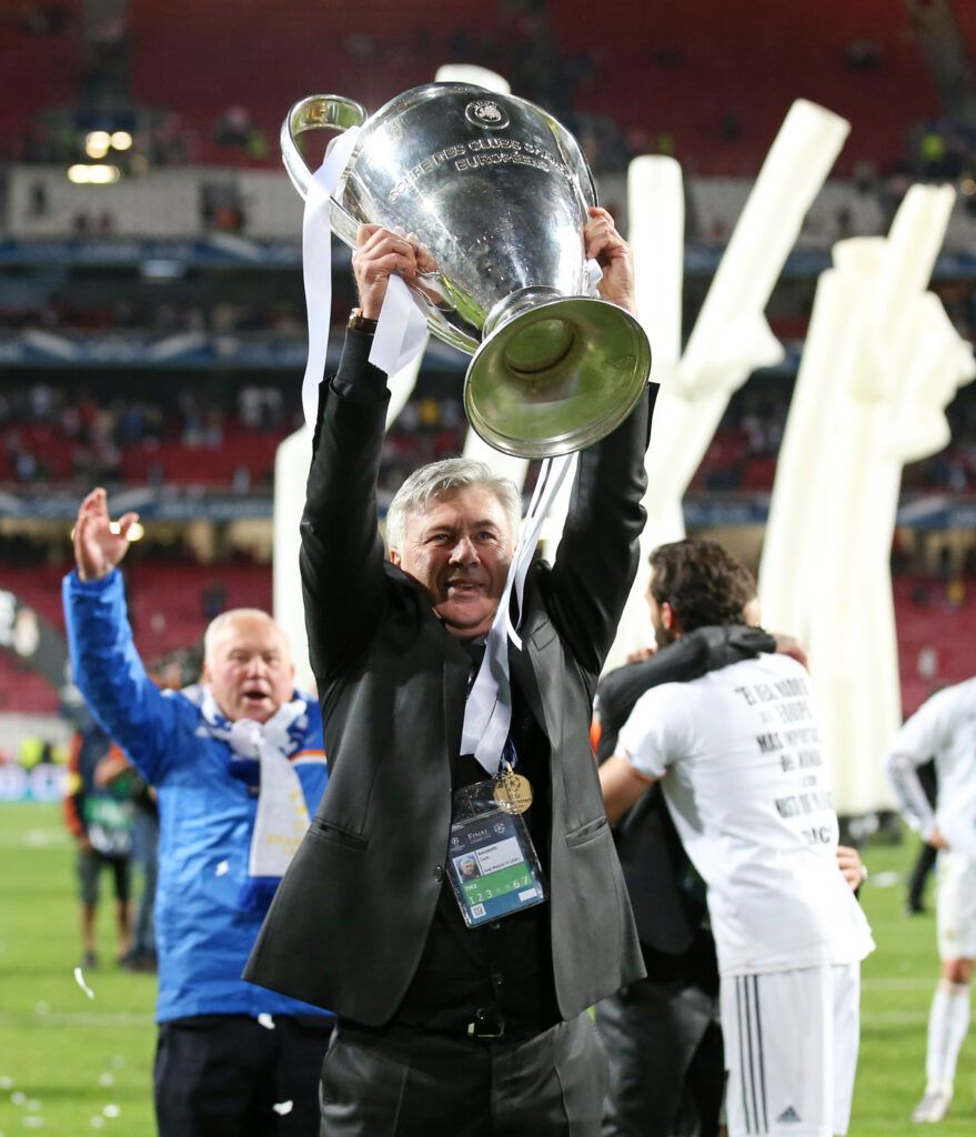 Ancelotti lifts the Champions League trophy.