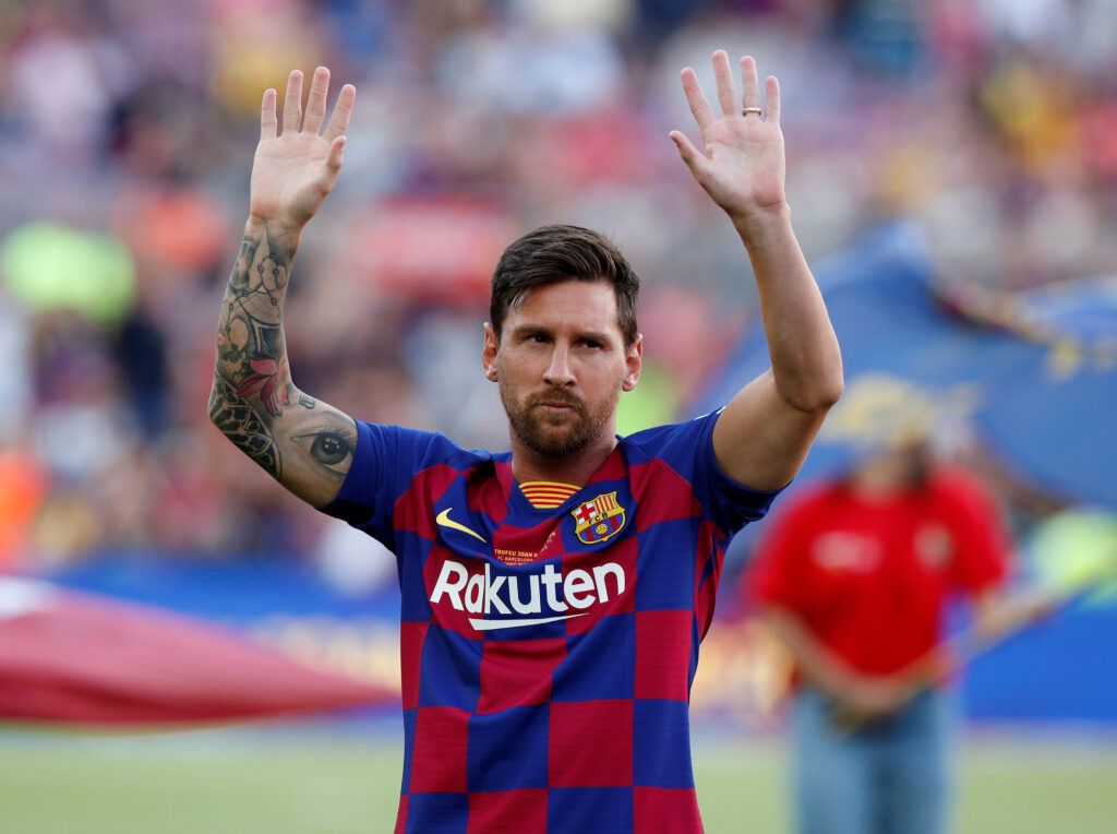 Messi greets Barcelona fans.