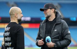 Klopp and Guardiola chat.