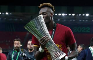 Abraham lifts the UECL trophy.