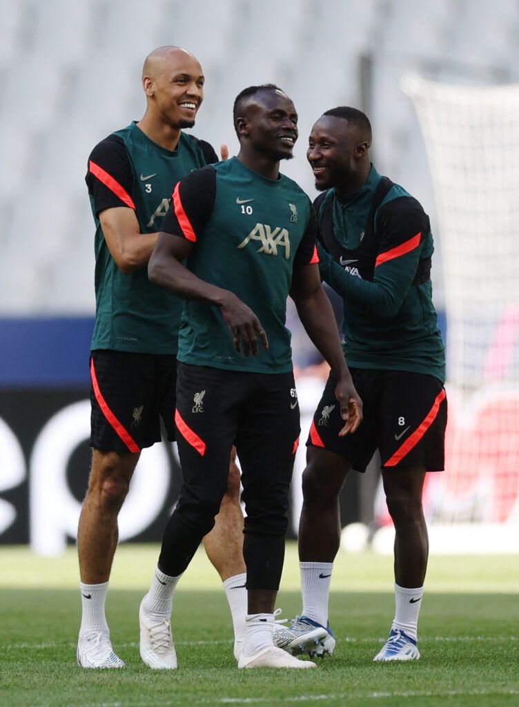 Liverpool laugh in training.
