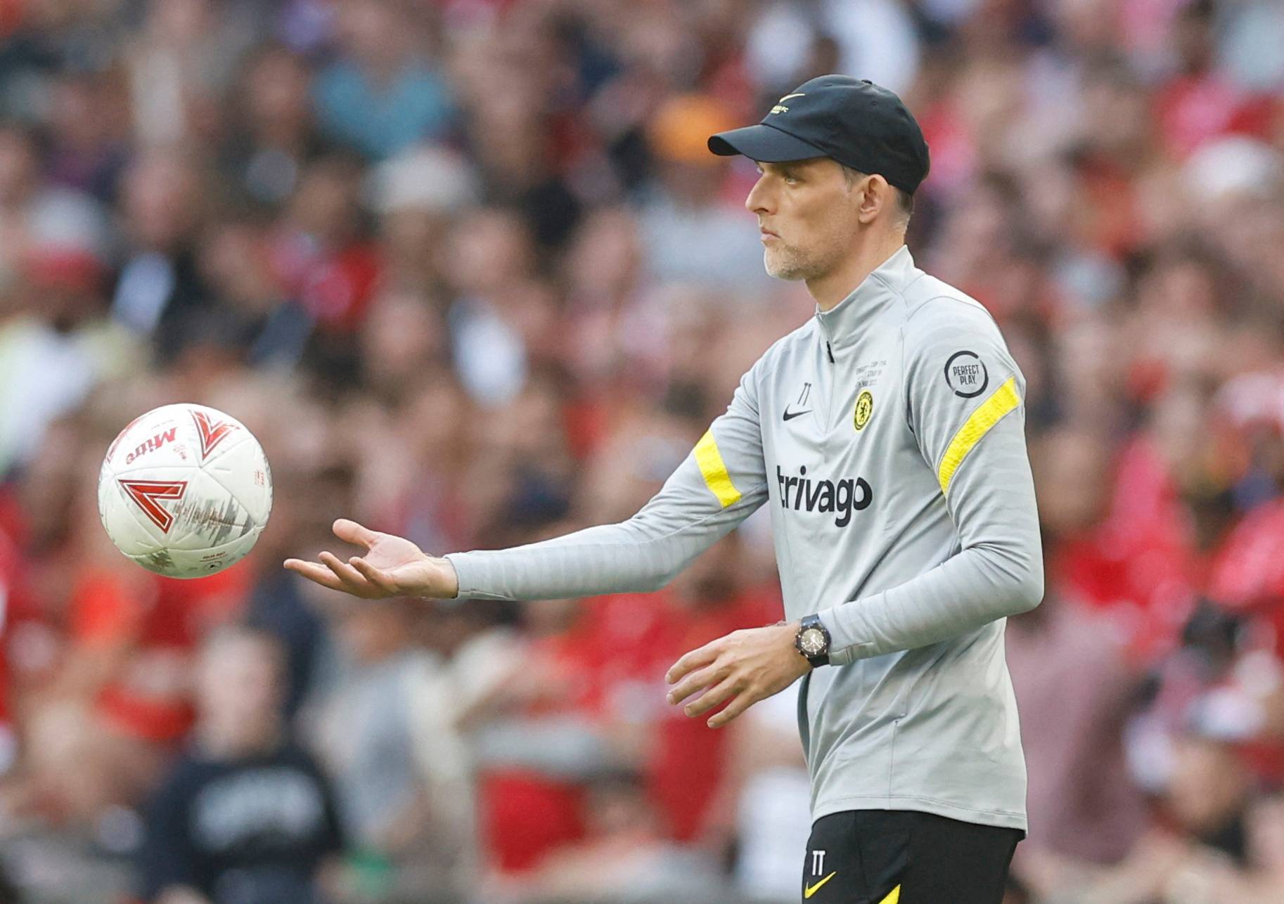 Chelsea manager Thomas Tuchel throwing the ball back into play