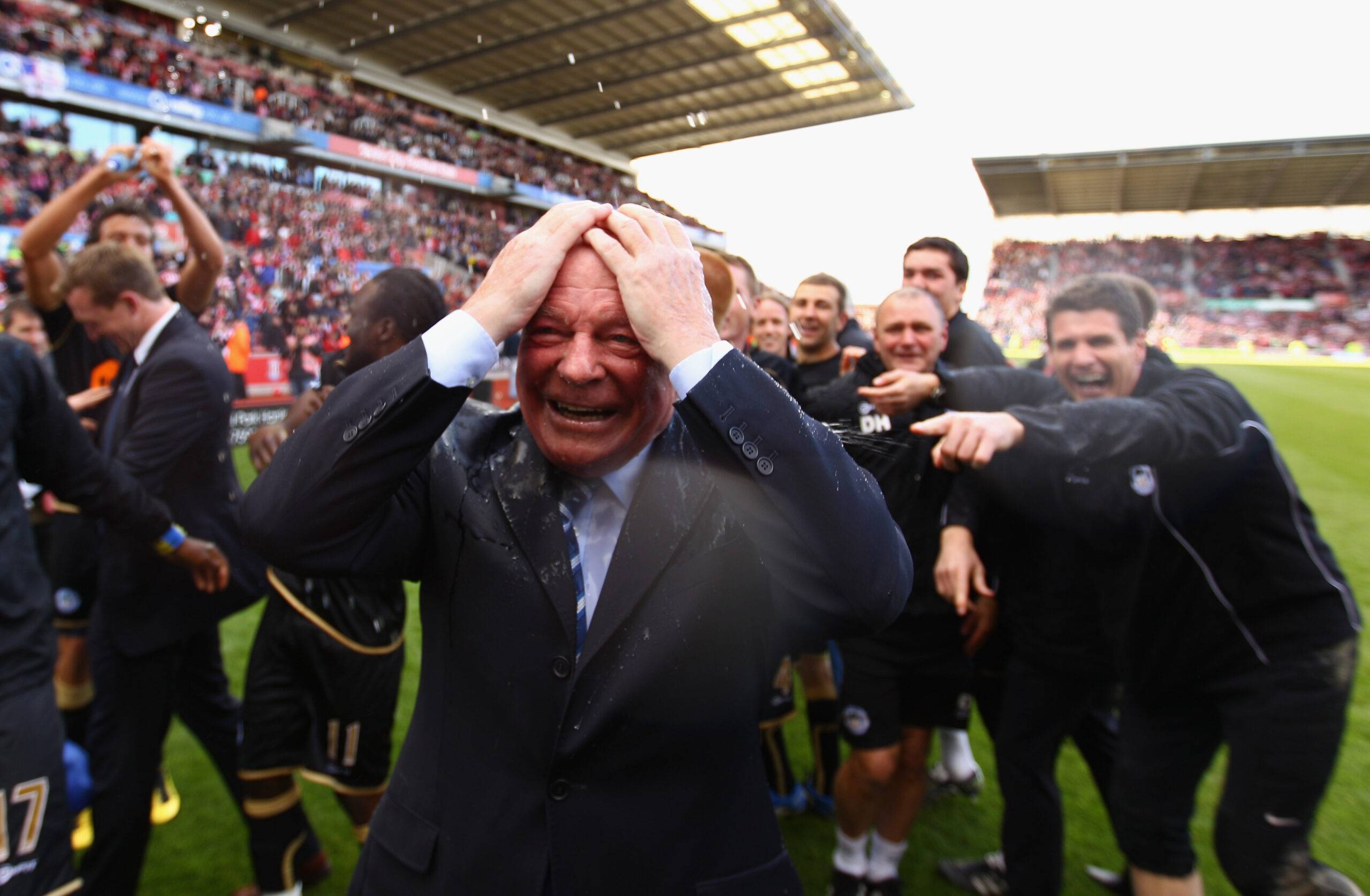 Dave Whelan celebrates Wigan retaining Premier League status
