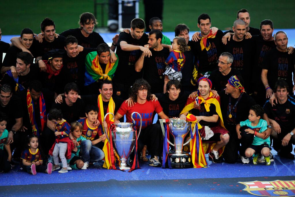 FC Barcelona players pose with the La Liga Tropy and the UEFA Champions League trophy during the celebrations after winning the UEFA Champions League Final against Manchester United.