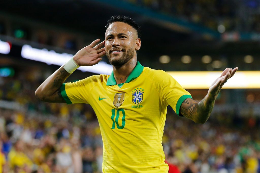 Neymar reacts after assisting a goal for Brazil