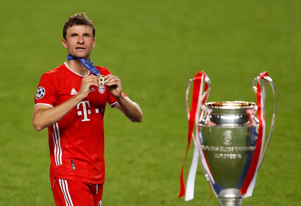 Bayern's Thomas Muller with the Champions League trophy
