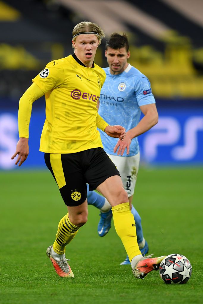Borussia Dortmund's Erling Haaland & Man City's Ruben Dias in action