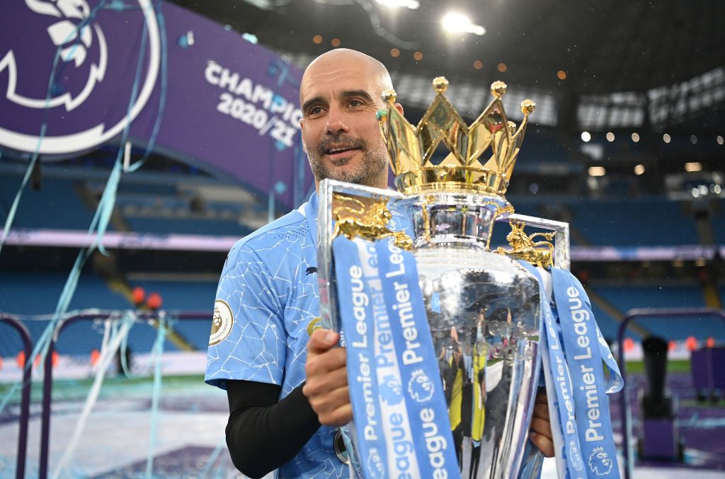 Man City manager Pep Guardiola with the Premier League trophy